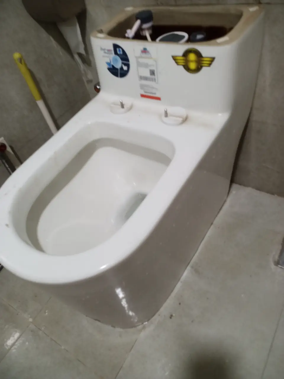 New commode installed in a bathroom